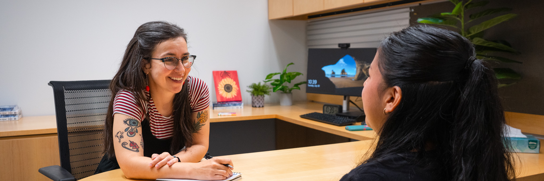 A staff member coaching a student.